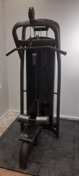 Techno Gym Lat Pulldown machine set on a dark gray rubber mat in a home gym environment.